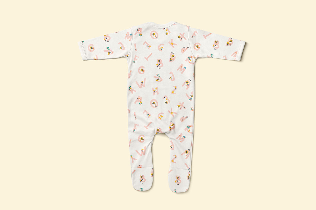 Back of baby rompersuit with pink alphabet pattern